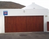 Double vertical slatted meranti tip up door