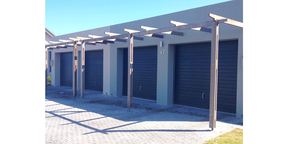 Single charcoal horizontal slatted aluzinc tip up doors with handles & padlocks