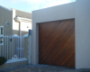 Single diagonally slatted meranti tip  up door